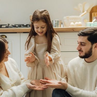 A cheerful family enjoying baking time in their cozy kitchen, fostering love and togetherness.